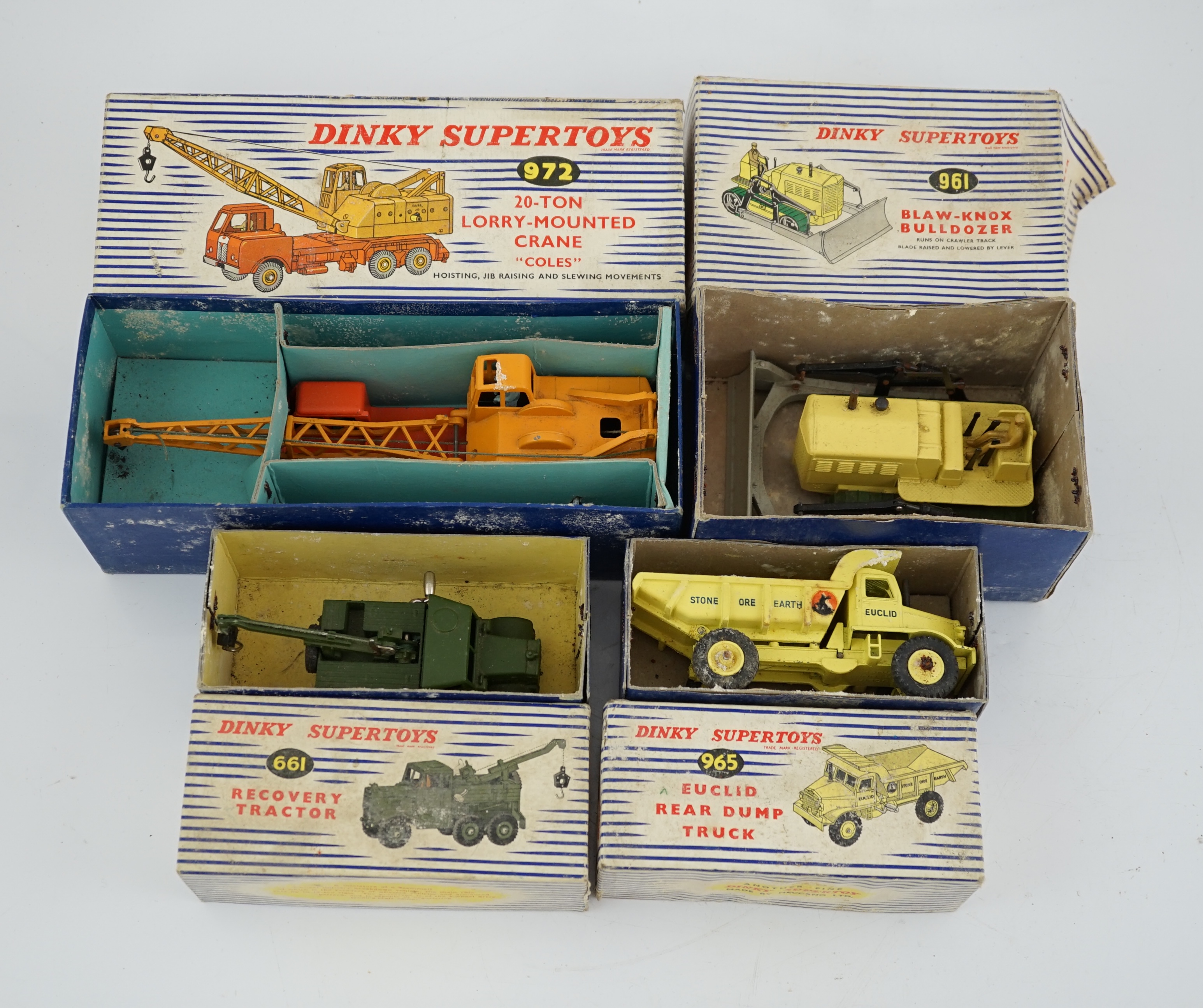 Thirteen Dinky Toys and Supertoys, etc. including; an MGB (113), a Riley Pathfinder, a Triumph Herald, an Armoured Command Vehicle (677), a 20-ton Mounted Crane (972), a Recovery Tractor (661)